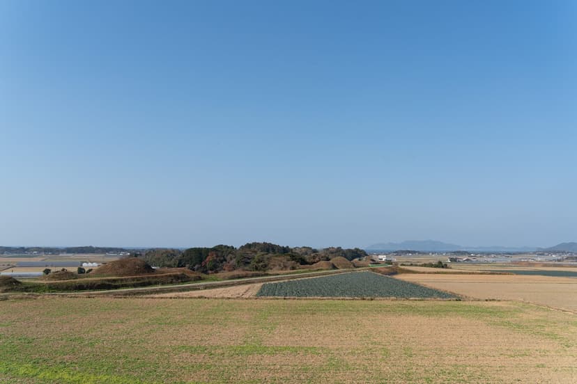 The Shinbaru-Nuyama burial mounds in Tsuyazaki, with the sea beyond